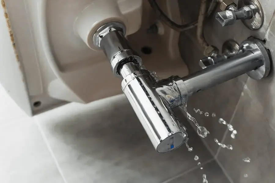 Featured Image Of A Leaking Pipe Under A Kitchen Sink